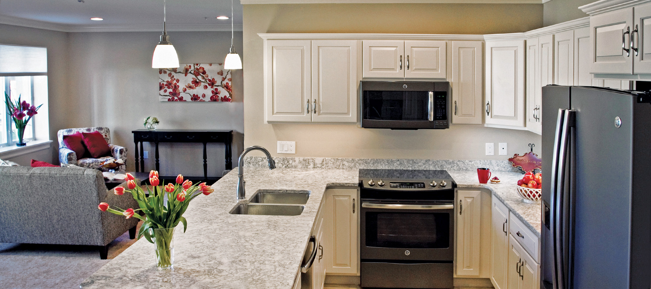 white kitchen and grey living room