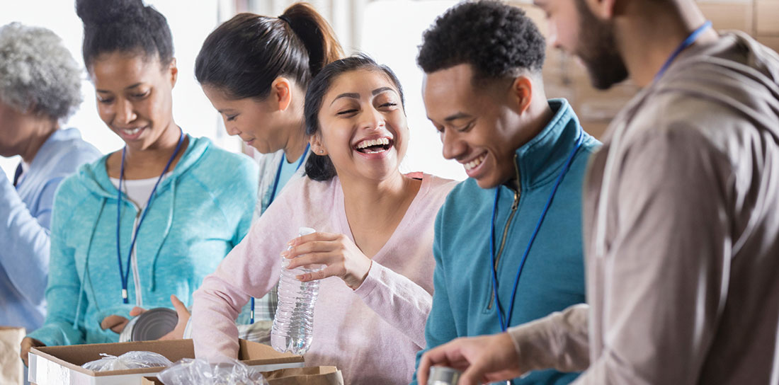 young group of smiling volunteers