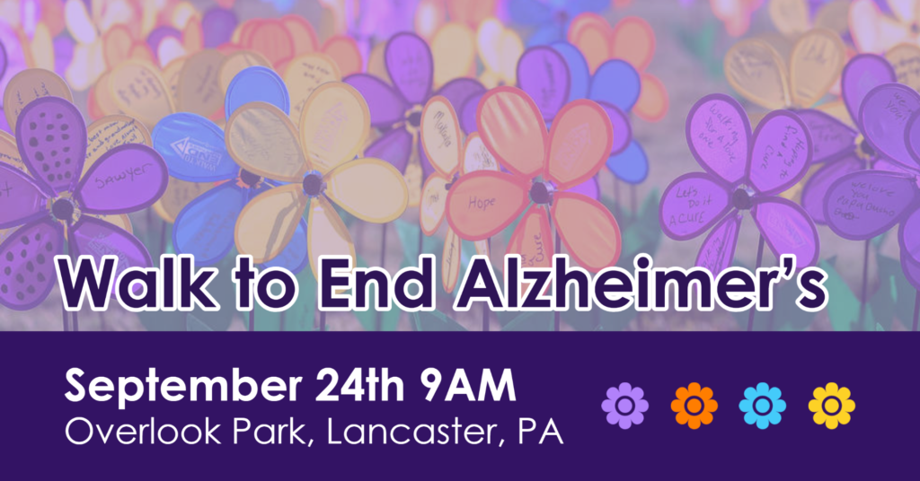 Text on top of a field of flowers that reads"Walk to End Alzheimer's, Septermber 24th 9AM, Overlook Park, Lancaster, PA