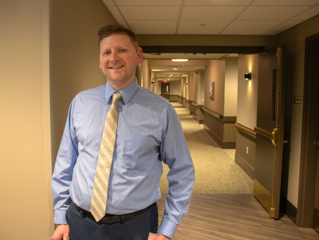 James Bennett standing in a hallway.